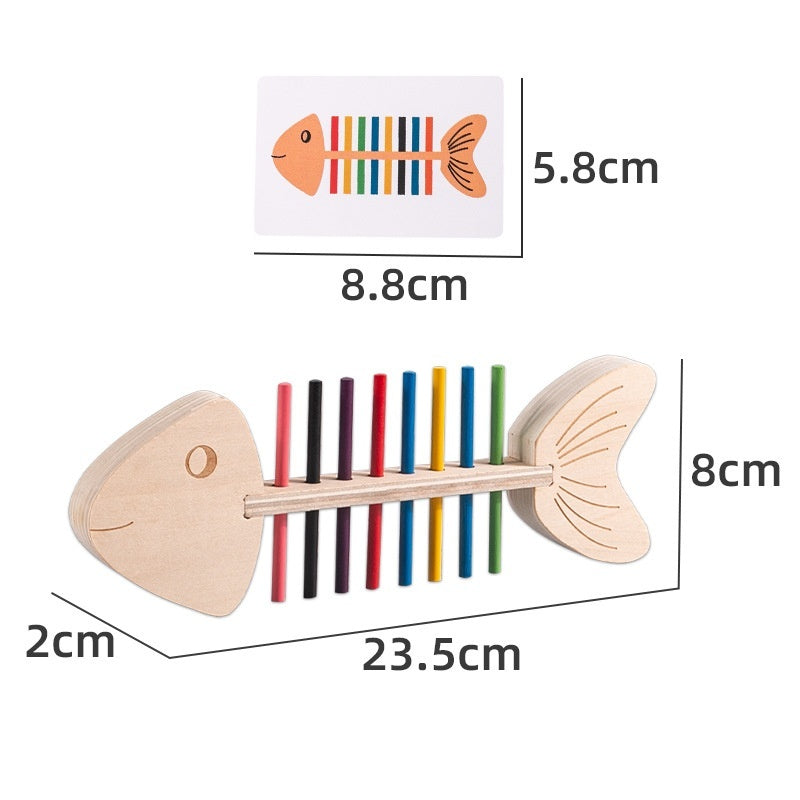 Wooden fish-shaped toy with colorful bars and measurements on a white background