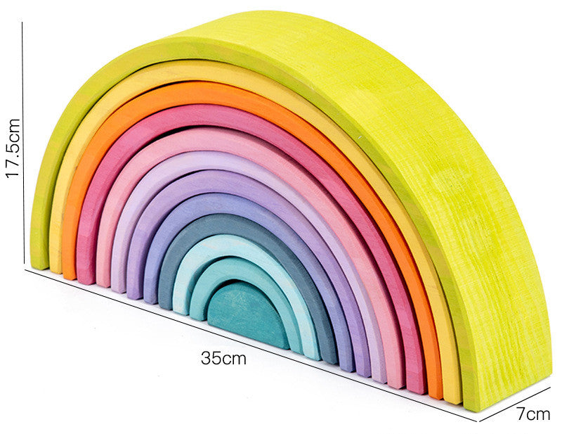 Colorful wooden rainbow toy with measurements on a white background