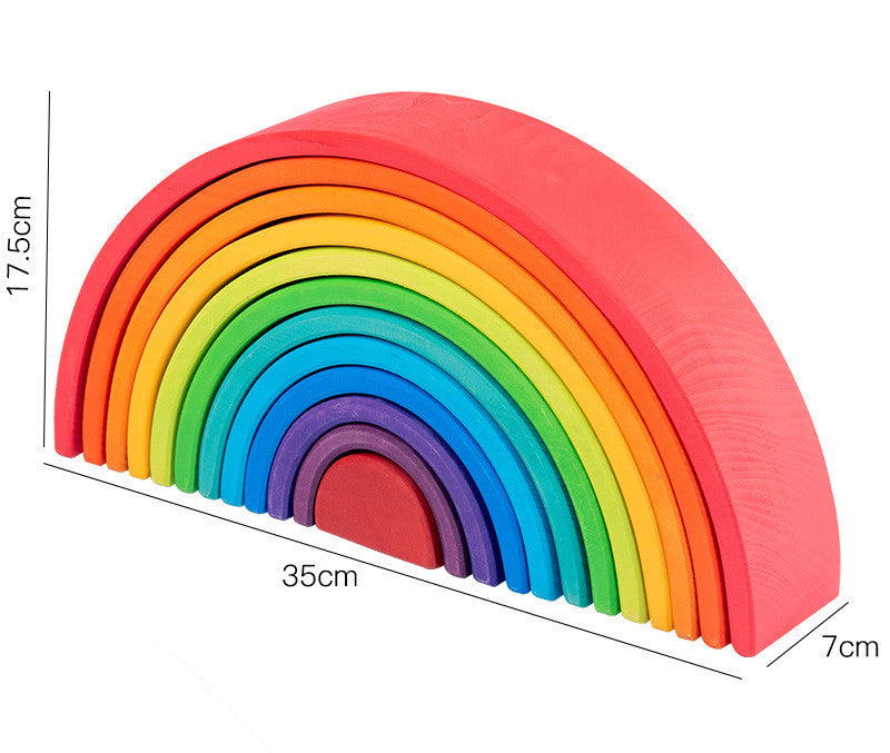 Colorful wooden rainbow toy with measurements on a white background