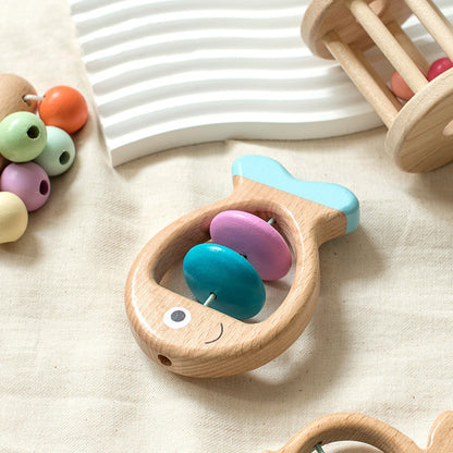 Wooden baby teether with colorful beads on a beige surface