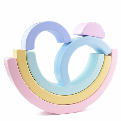 Colorful wooden ring toy on a white background