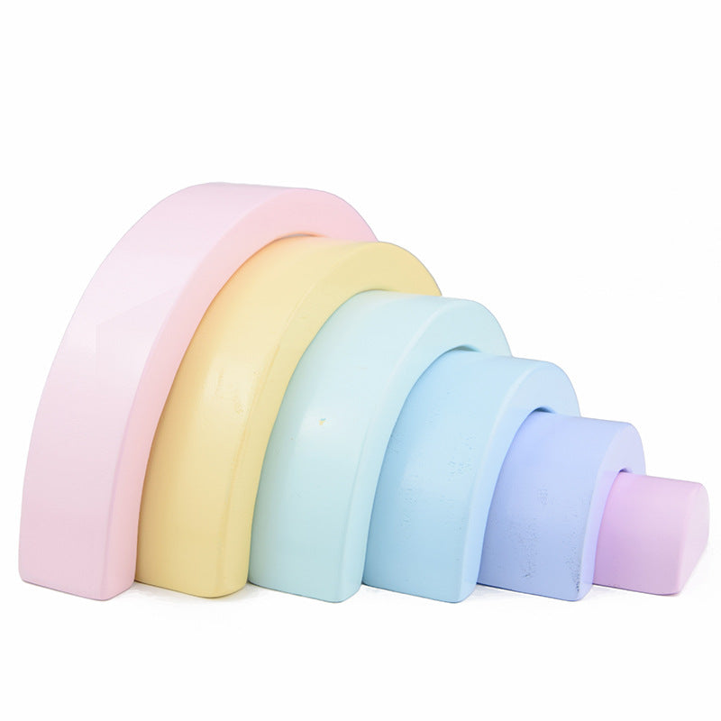 Set of pastel-colored arch-shaped objects on a white background