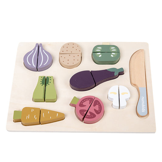 Wooden toy set of vegetables and a knife on a white background