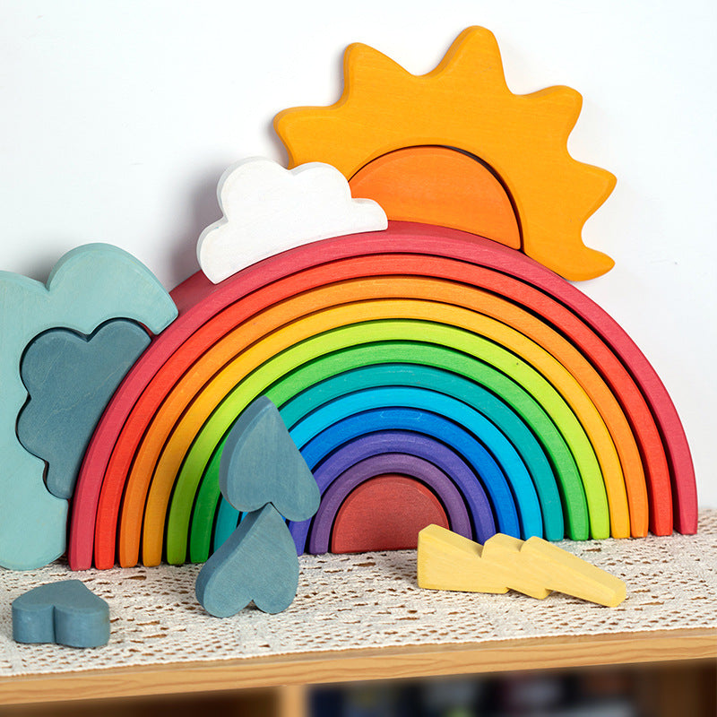 Colorful wooden rainbow with sun, clouds, and lightning bolt on a textured surface