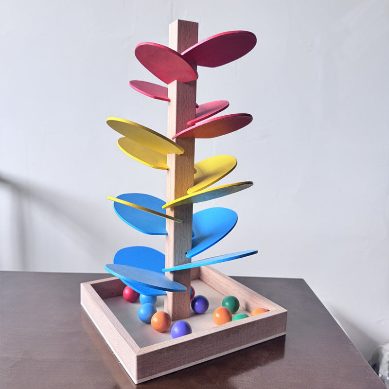Colorful wooden toy with rotating disks on a wooden base