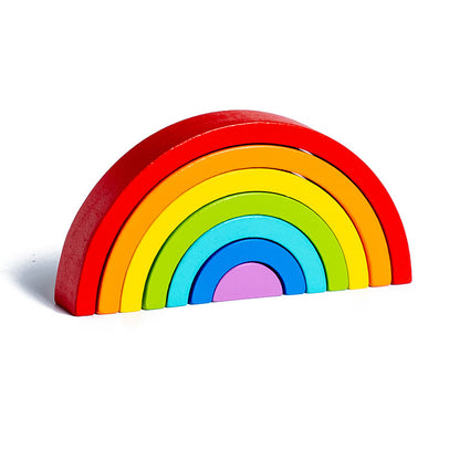 Colorful wooden rainbow toy on a white background