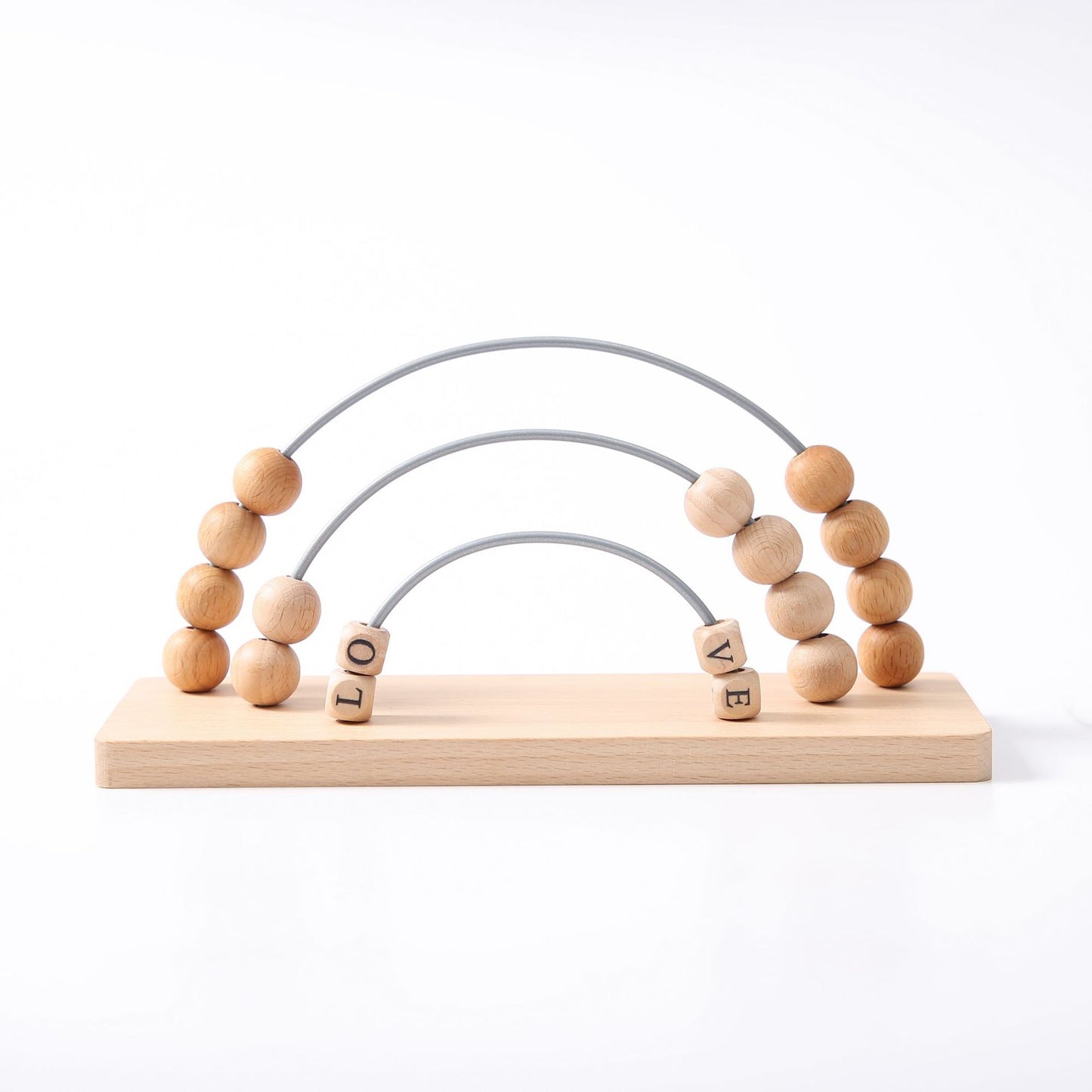 Wooden toy with beads and letters spelling 'LOVE' on a white background