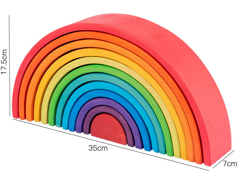 Colorful wooden rainbow toy with measurements on a white background
