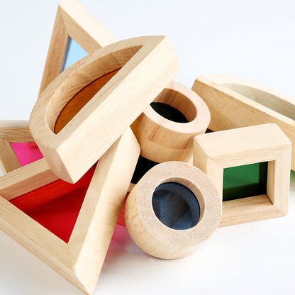 Wooden geometric shape sorter toy with colorful interior compartments on a white background