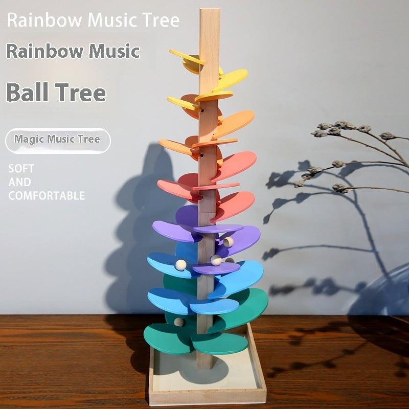 Colorful wooden ball tree with text indicating it's a 'Rainbow Music Ball Tree' on a wooden surface.