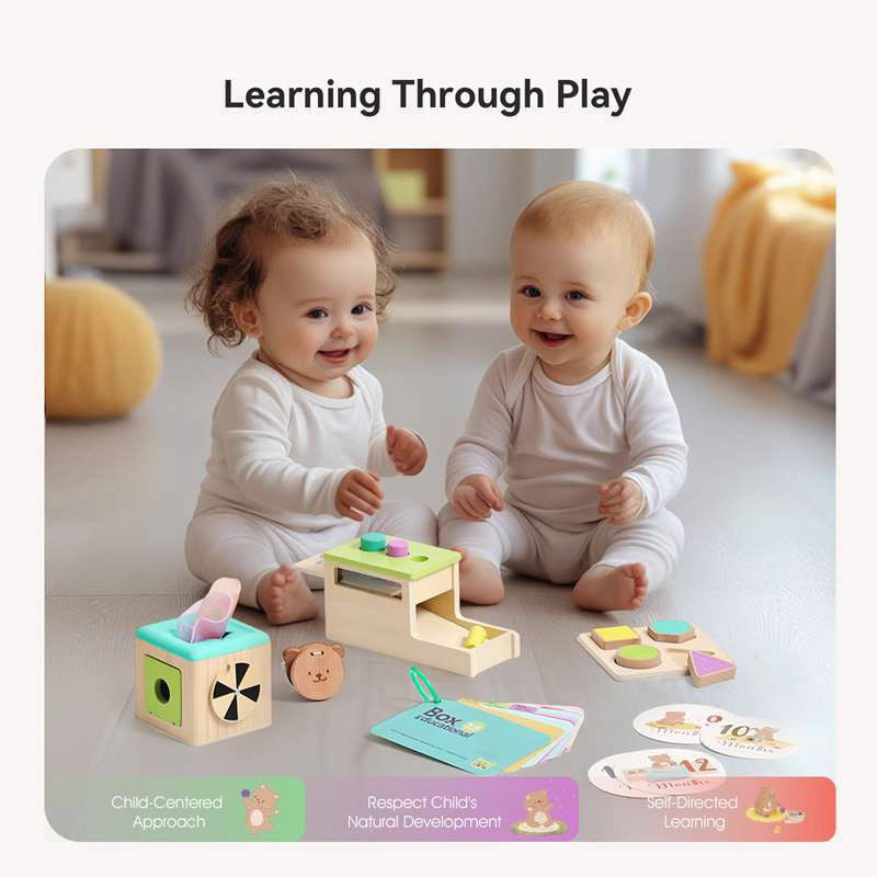 Two babies playing with educational toys on a light-colored floor.