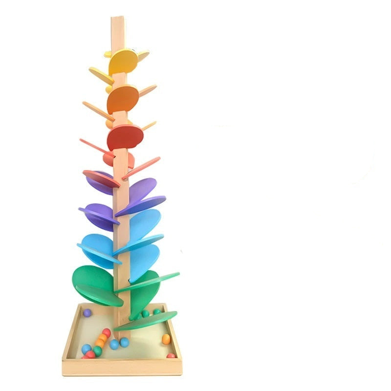Colorful wooden toy tree with packaging on a white background