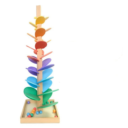 Colorful wooden toy tree with packaging on a white background