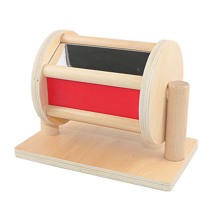 Wooden toy with a red interior and black top on a white background