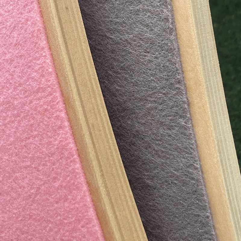 Close-up of pink, gray, and beige felt strips of balance boards
