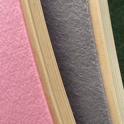 Close-up of pink, gray, and beige felt strips of balance boards