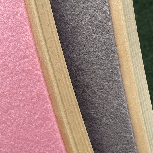 Close-up of pink, gray, and beige felt strips of balance boards