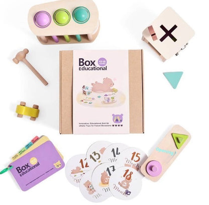 Educational toys and materials including a wooden hammer, shape sorter, and number cards on a white background.